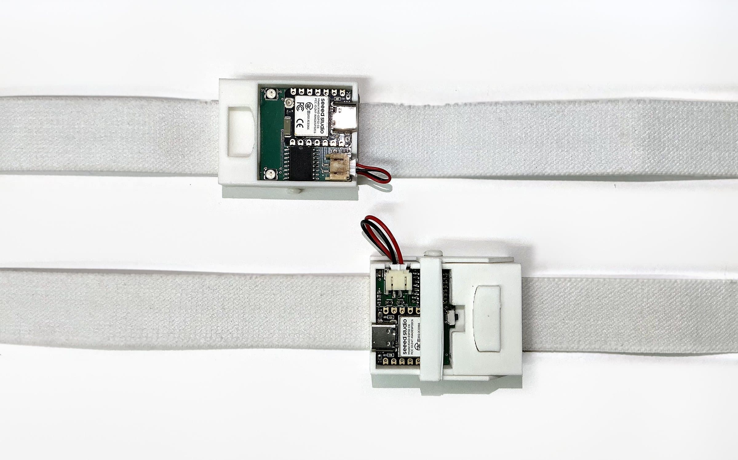 Two Infusinator prototypes, top-down on their elastic straps
